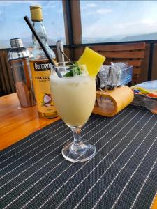 a drink in a glass sitting on a table at Camp Ayza Elementaita in Kariandus