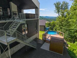 a house with stairs and a swimming pool at 32 Chemin Blanc in Stoneham