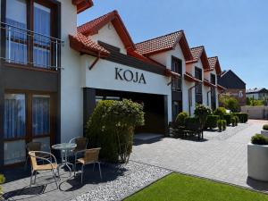 a building with a kota sign on the side of it at Koja in Rowy