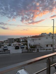 a view of a street with cars parked in a parking lot at Xhan Apartments in Ulcinj