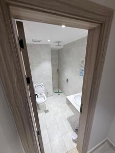 a bathroom with a toilet and a sink at Ritaj Al-Tala'i in Mecca +18 photos