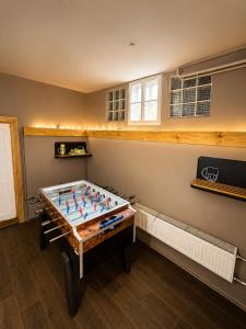 a large pool table in a room at Basecamproll in Pec pod Snezkou