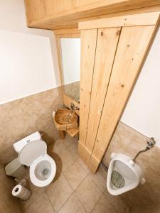 a bathroom with a toilet and a sink at Basecamproll in Pec pod Snezkou