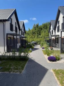 a row of houses with a walkway between them at PORTKNAUBER in Rowy