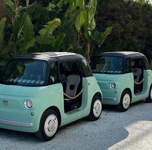two green cars parked next to each other at La Serena Forte dei Marmi, Small Luxury Hotels of the World in Forte dei Marmi
