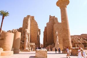 a group of people walking in front of a monument at Vipxplor Travel in Luxor