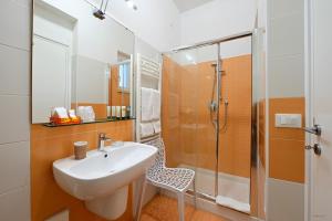 a bathroom with a sink and a shower at Pepe'Accommodation in Parghelia +66 photos
