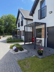 a house with a patio in front of it at PORTKNAUBER in Rowy
