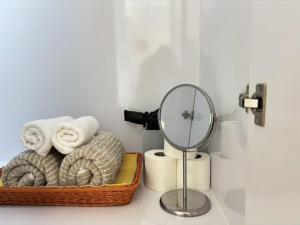 a bathroom with a basket of towels and a mirror at Bangkok Prime Location Residence in Makkasan +275 photos