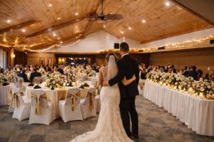 a bride and groom walking down the aisle at their wedding at Round Barn Lodge in Spring Green