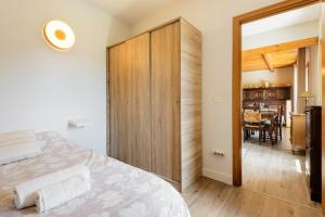 a bedroom with a bed and a dining room at Casa Rural Uria in Gavín