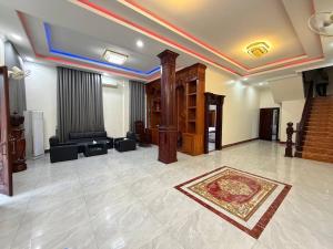 a lobby with a room with a couch and a rug at Suman Thapa House in Kathmandu