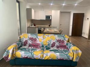 a living room with a couch and a kitchen at Casa vacanza Gea - Superior Apartment in Bergamo city with private parking car in Bergamo