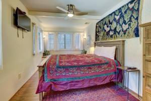 a bedroom with a large bed and a tv at The Crow's Nest in Idyllwild +15 photos