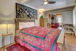 a bedroom with a large bed with a colorful bedspread at The Crow's Nest in Idyllwild