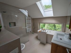 a bathroom with a sink and a window at ZenHouseApartment in Ljubno +24 photos