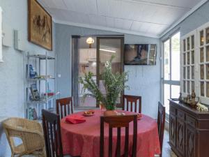 a dining room with a table with a red table cloth at Akisol Hostel Idanha in Idanha-a-Nova