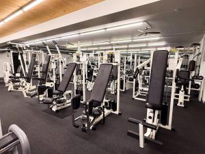a gym with a lot of tread machines at 2-3 Personen Apartment mit Bergblick in Landeck