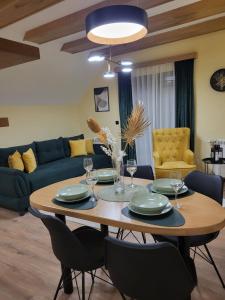 a living room with a table and chairs at Tara Saric Duplex in Kaludjerske Bare
