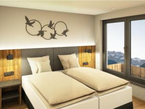 a bedroom with a bed with fish on the wall at App. Sun Burdengeja in Selva di Val Gardena