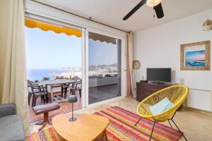 a living room with a view of the ocean at Casa Trino in Almuñécar