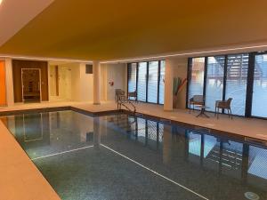 a large swimming pool in a house with a large at DOMITYS - Les Ambres in Cognac