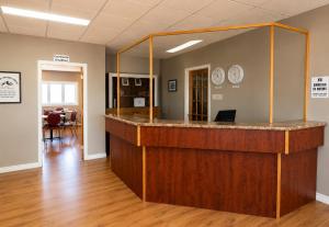 a lobby with a large mirror on the wall at Hotel Blanc-Sablon in Blanc-Sablon
