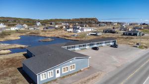 an aerial view of a house and a road at Hotel Blanc-Sablon in Blanc-Sablon