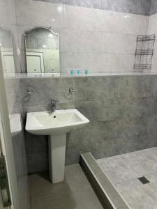 a bathroom with a sink and a mirror at Inn David in Chakvi +243 photos