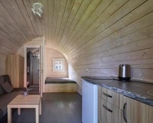 a tiny house with a bed in a room at Jūros terasos in Šventoji +30 photos