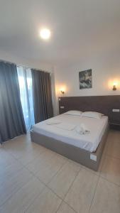 a bedroom with a large bed in a room at Vila Arthur in Eforie Nord +22 photos