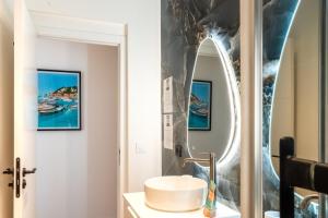 a bathroom with a sink and a mirror at Maison Rouget - Chambre 1 - Mimosa in Nice +29 photos