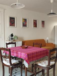 a dining room with a table and a couch at Casa Annina in Basilicata in Trivigno +15 photos