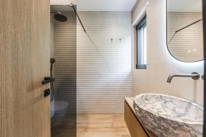 a bathroom with a marble sink and a shower at Odat n'Bogë - Breakfast Included by PikHost in Bogë +67 photos