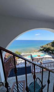 a view of the ocean from a balcony at Casa Elvira in Isola Capo Rizzuto