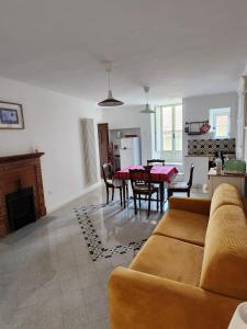 a living room with a couch and a table at Casa Annina in Basilicata in Trivigno