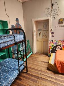 a room with two bunk beds and a hallway at Hostel Backpacker in Ulcinj +1 photo