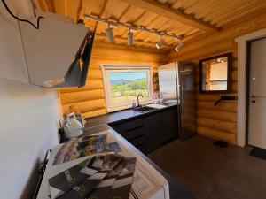 a kitchen with a sink and a counter top at Mountain View in Vyshkove +66 photos