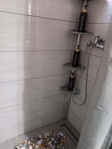 a corner of a bathroom with a toilet and shelves at Heidis Haus in Polygryos