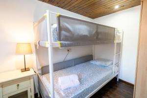 two bunk beds in a small room with a lamp at El Llagar de Ternín in Villaviciosa +21 photos