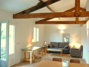 a living room with a couch and a table at Maison Oyan in Urrugne