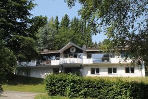 a large white house with a balcony at Villa Boskoop in Stryck