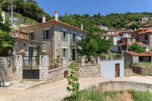 an old stone house in a small village at Orange House - Upper West apartment in Promírion
