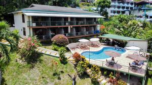 an aerial view of a hotel with a swimming pool at Tabulia Tree Hotel and Villas in Manuel Antonio