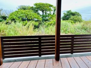 a view from a window of a deck with trees at AZ Hotel - Vacation STAY 56058v in Akaoki