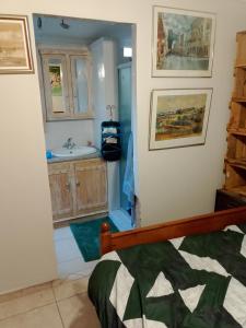 a small bathroom with a sink and a sink at Lamenatseach 300 in Leeupoort