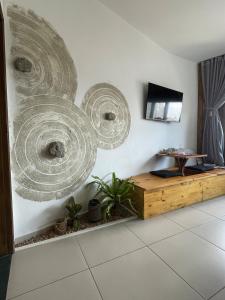 a living room with a painting on the wall at Ryokan in São Paulo