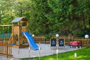 a playground with a slide and a slideintend at Tesao Room by Dworek Marino in Grzybowo
