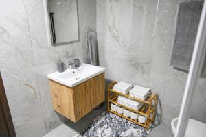 a white bathroom with a sink and a shower at North Forest in Žabljak +40 photos