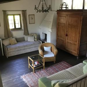 a living room with a couch and a table at Chalet fronte piscina in Zambra +29 photos